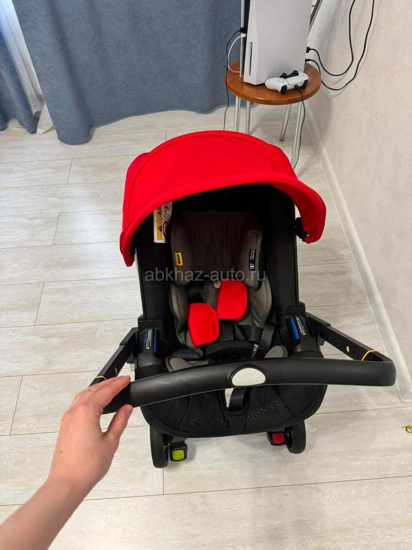 Продам автокресло-коляску Doona